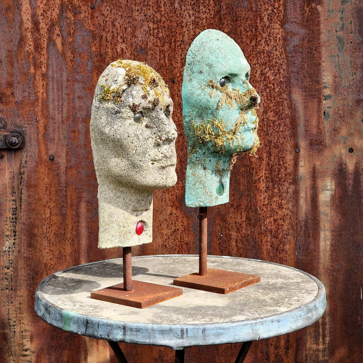 2 cast stone heads