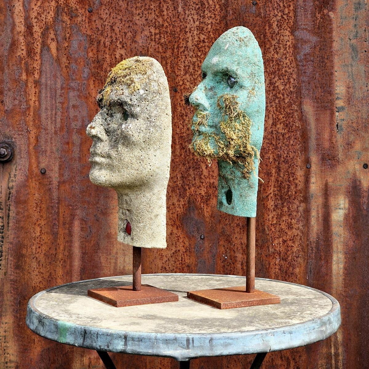 2 cast stone heads