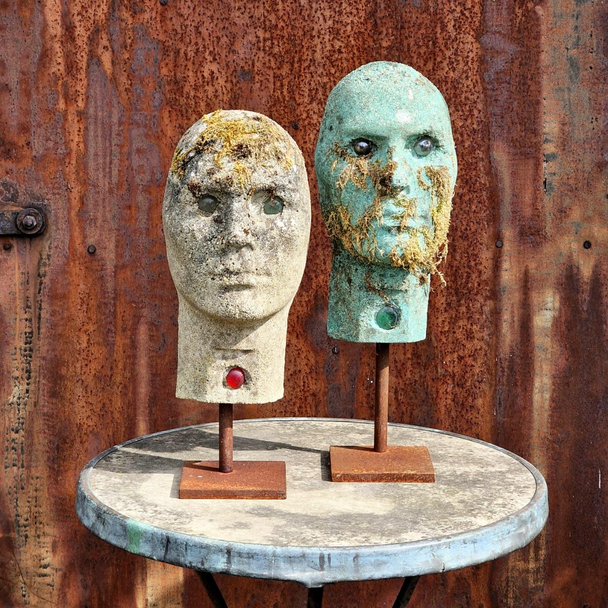 2 cast stone heads