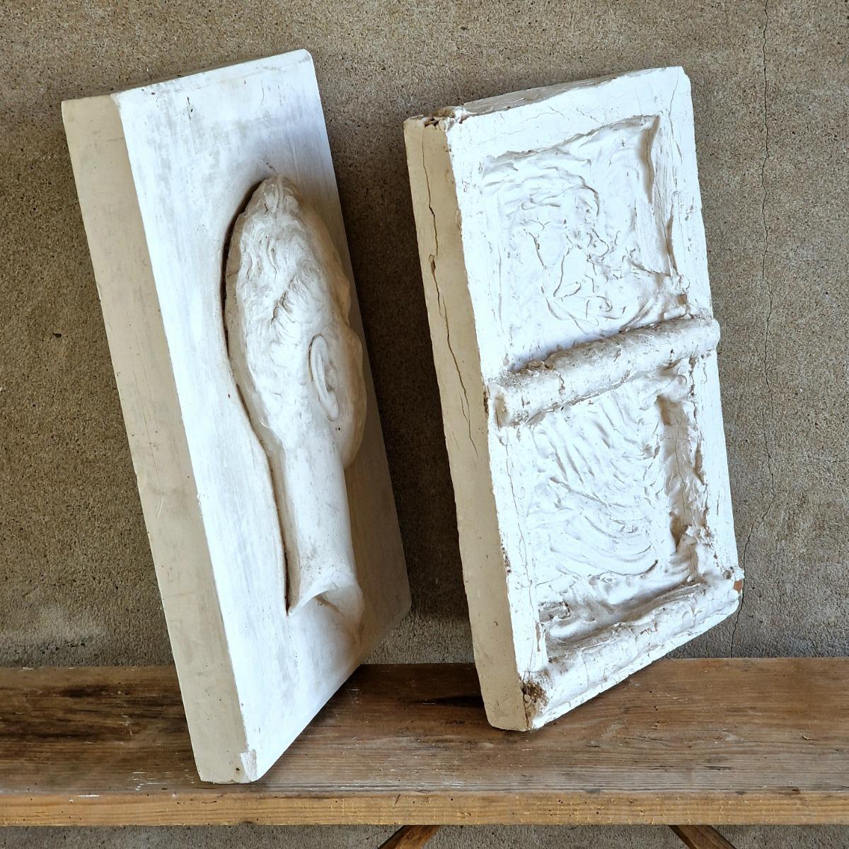 2 plaster bas-relief panels