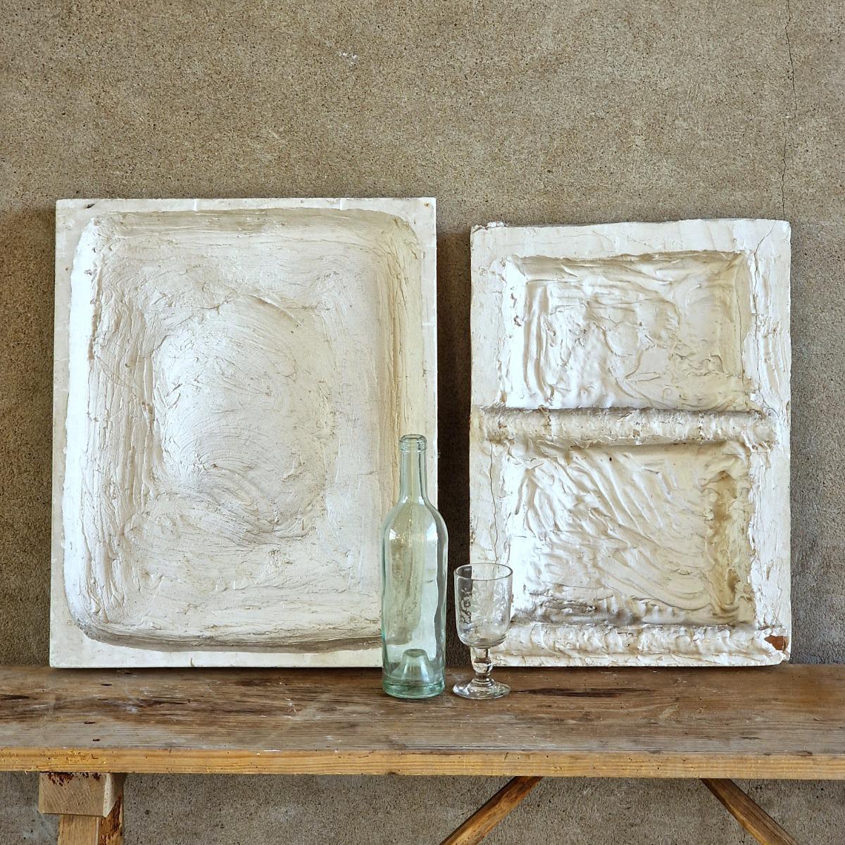 2 plaster bas-relief panels