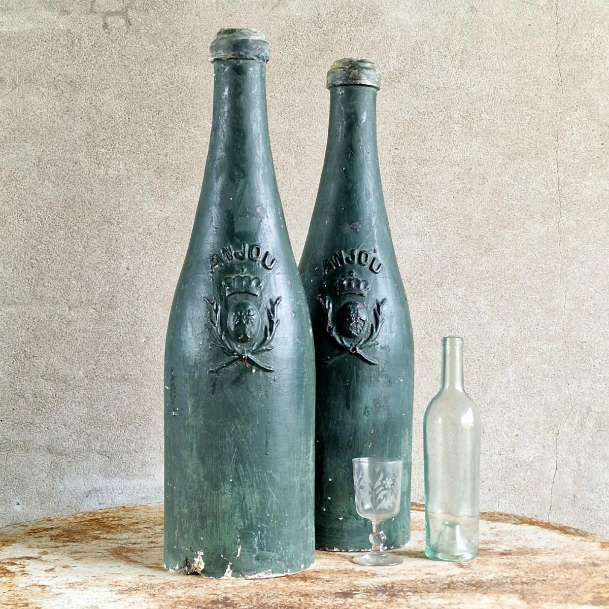 2 XL plaster wine bottles