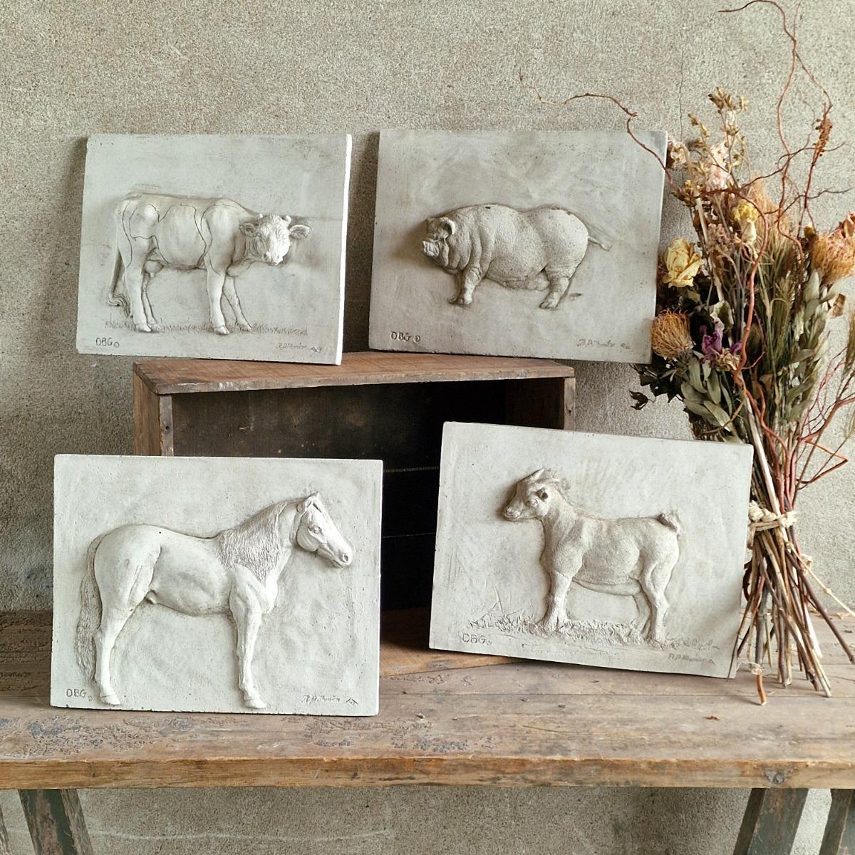 4 cast stone animal tiles