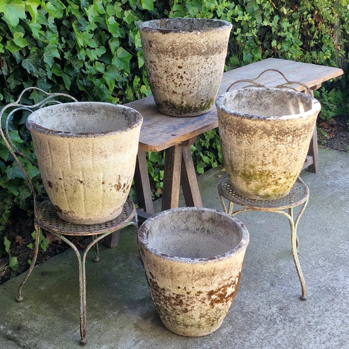 4 weathered round planters