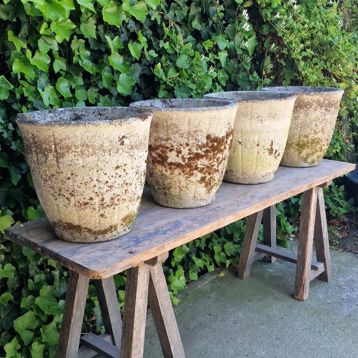 4 weathered round planters