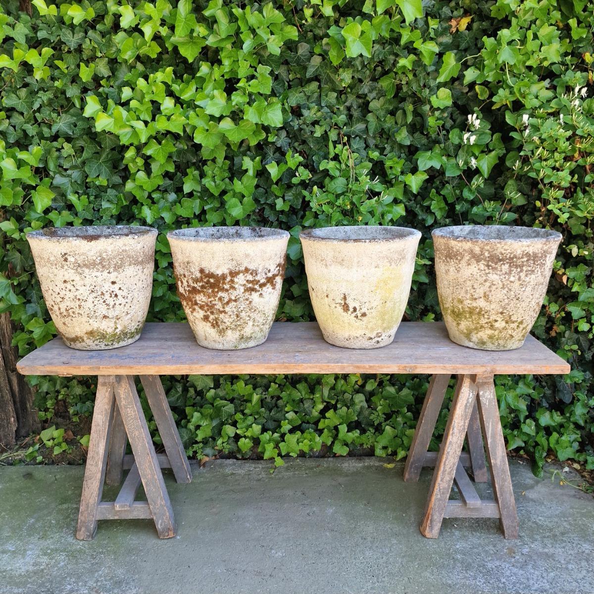 4 weathered round planters