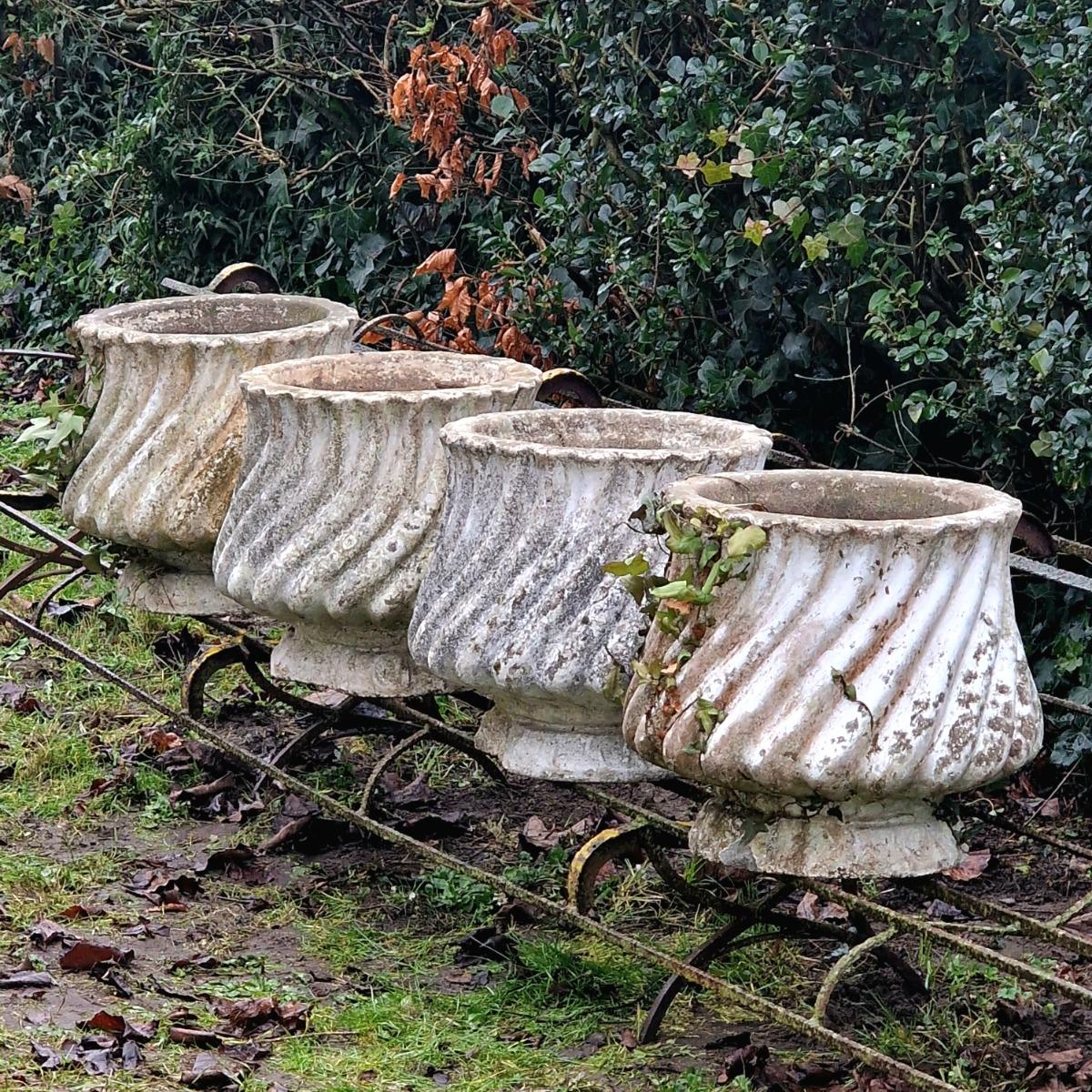 4 white cast stone planters