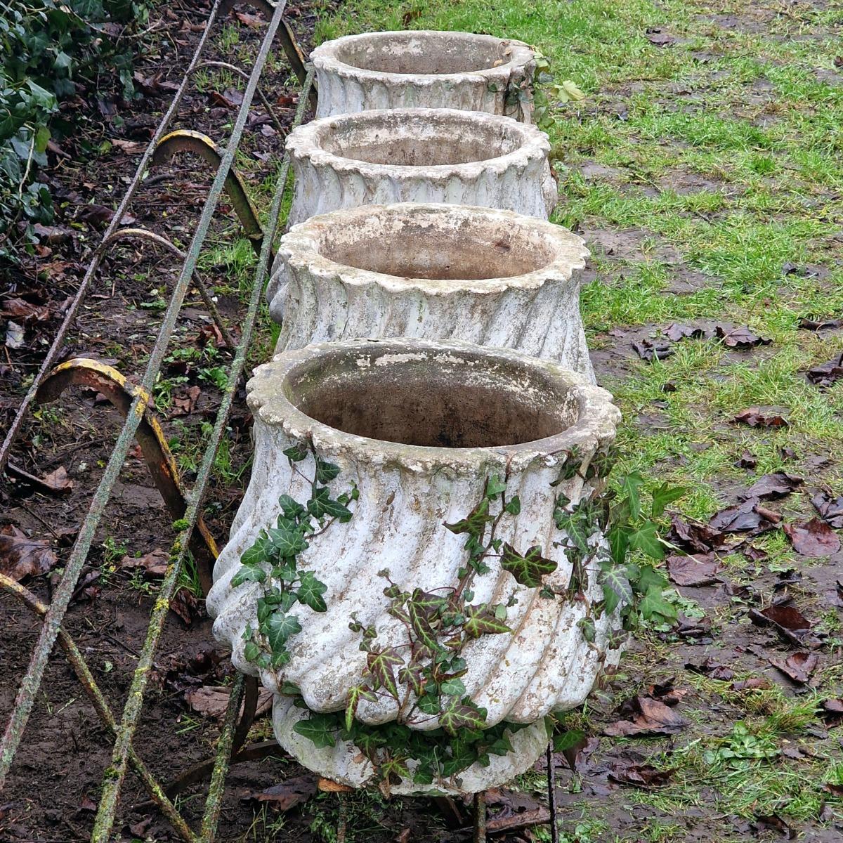 4 white cast stone planters