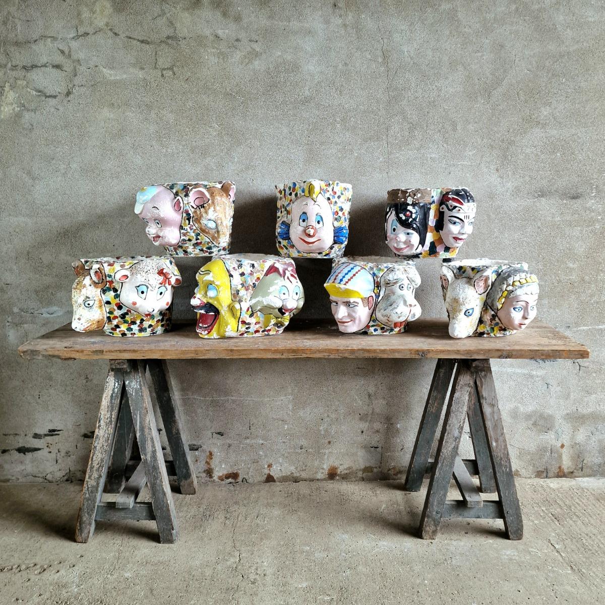 7 painted plaster cache-pots