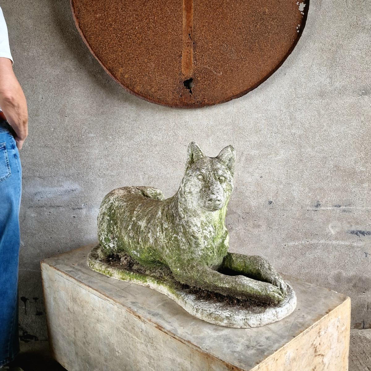 Cast stone dog sculpture