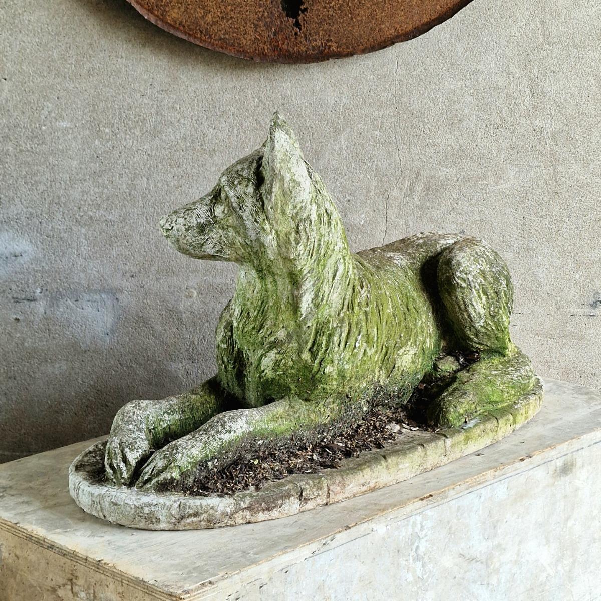 Cast stone dog sculpture