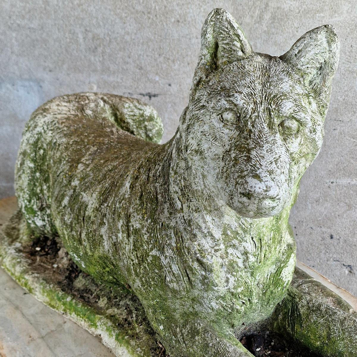 Cast stone dog sculpture