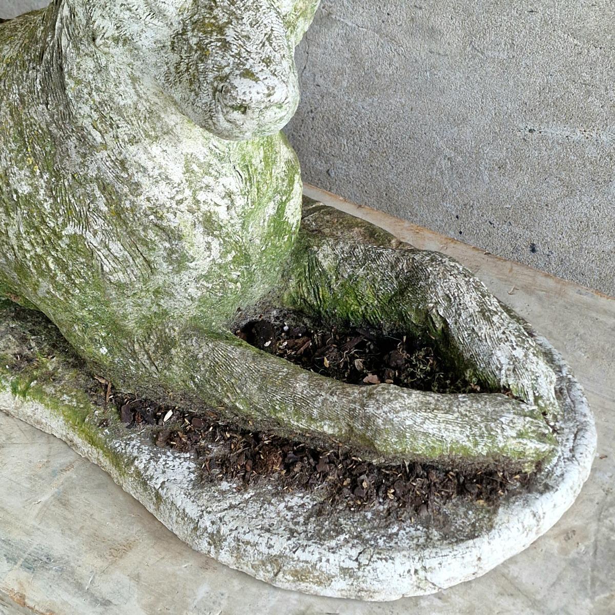 Cast stone dog sculpture