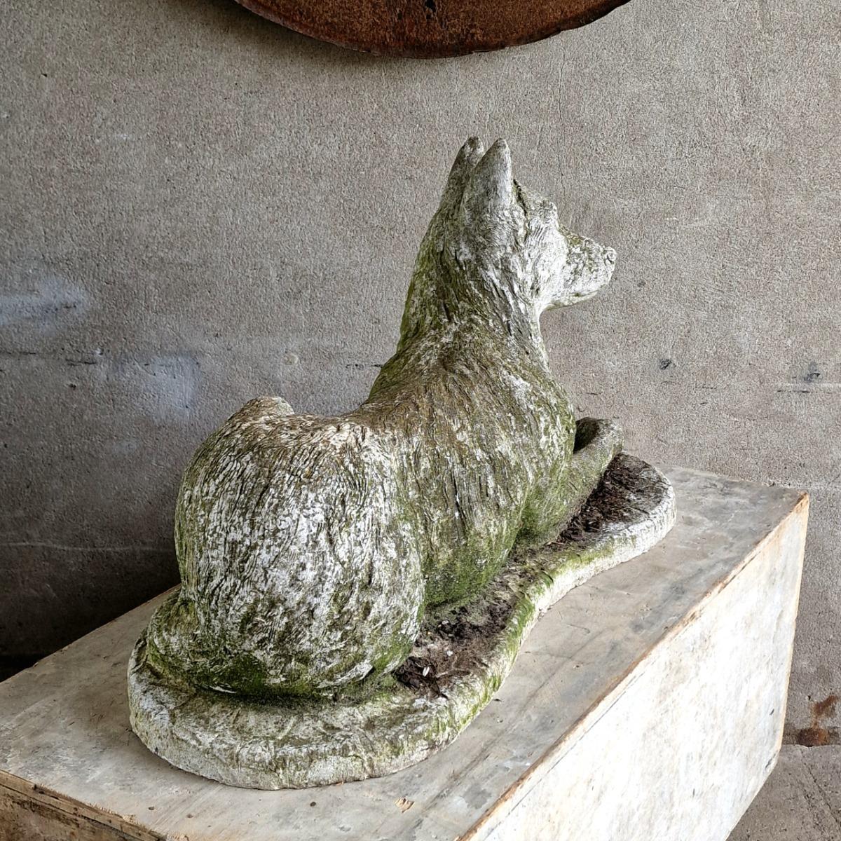 Cast stone dog sculpture