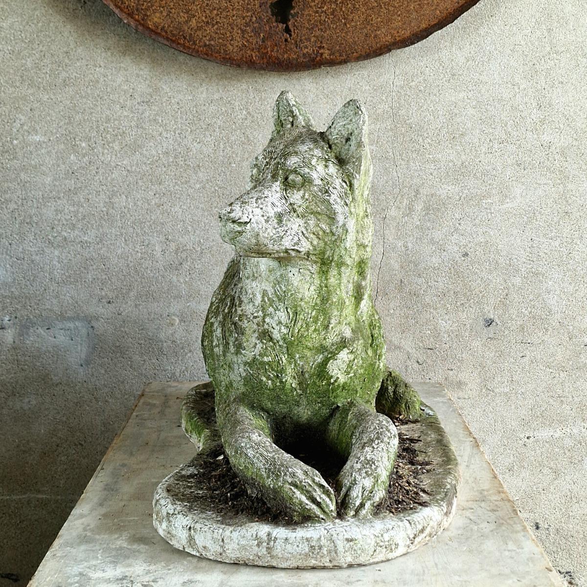 Cast stone dog sculpture
