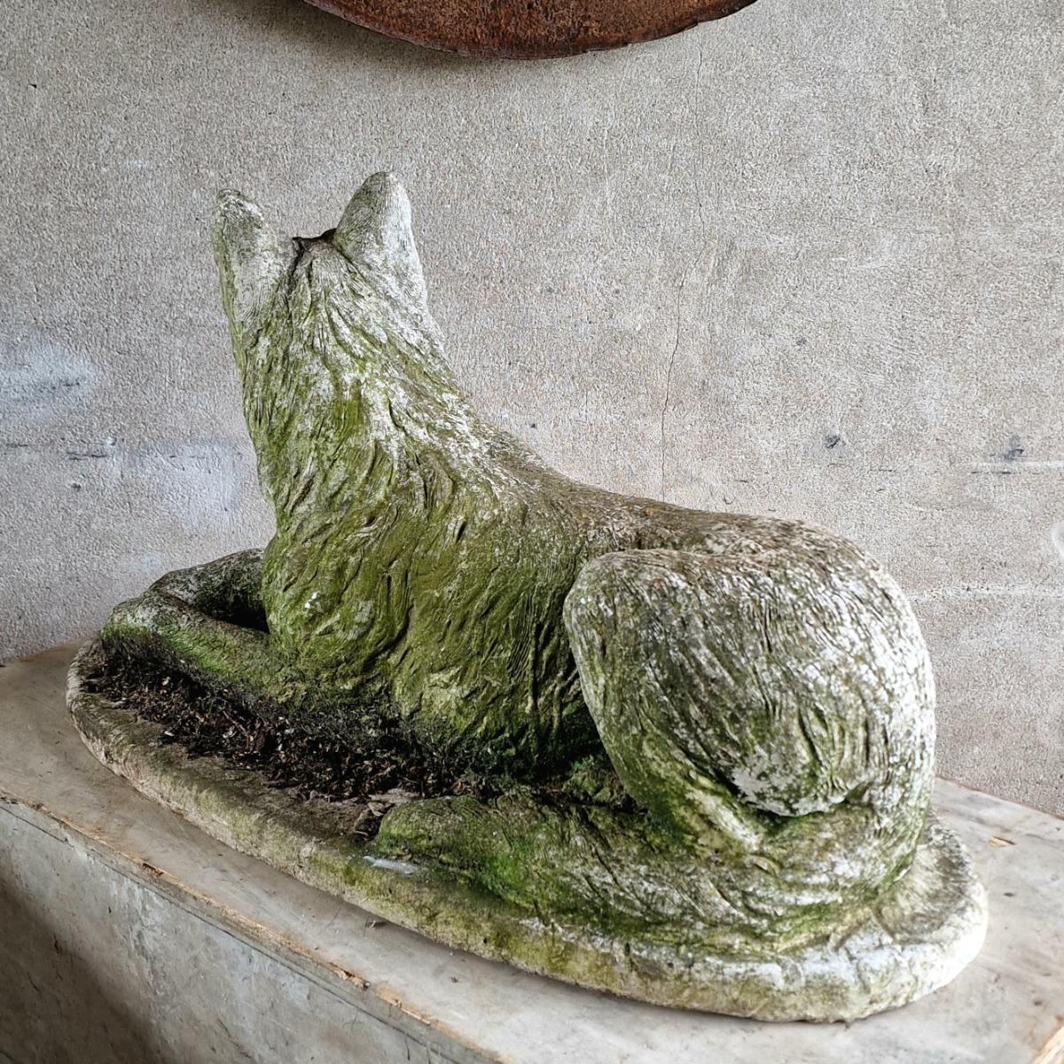 Cast stone dog sculpture