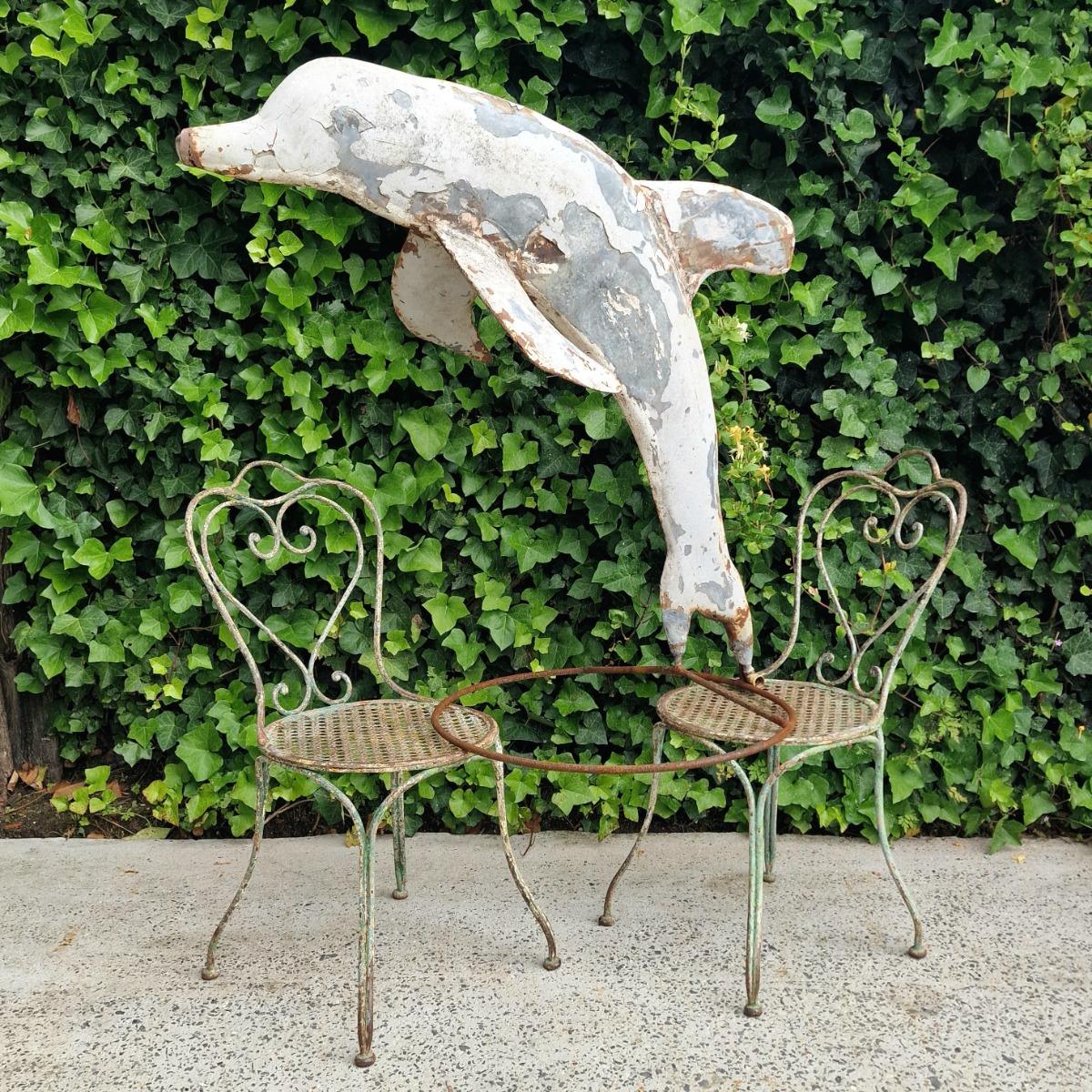 Metal dolphin fountain