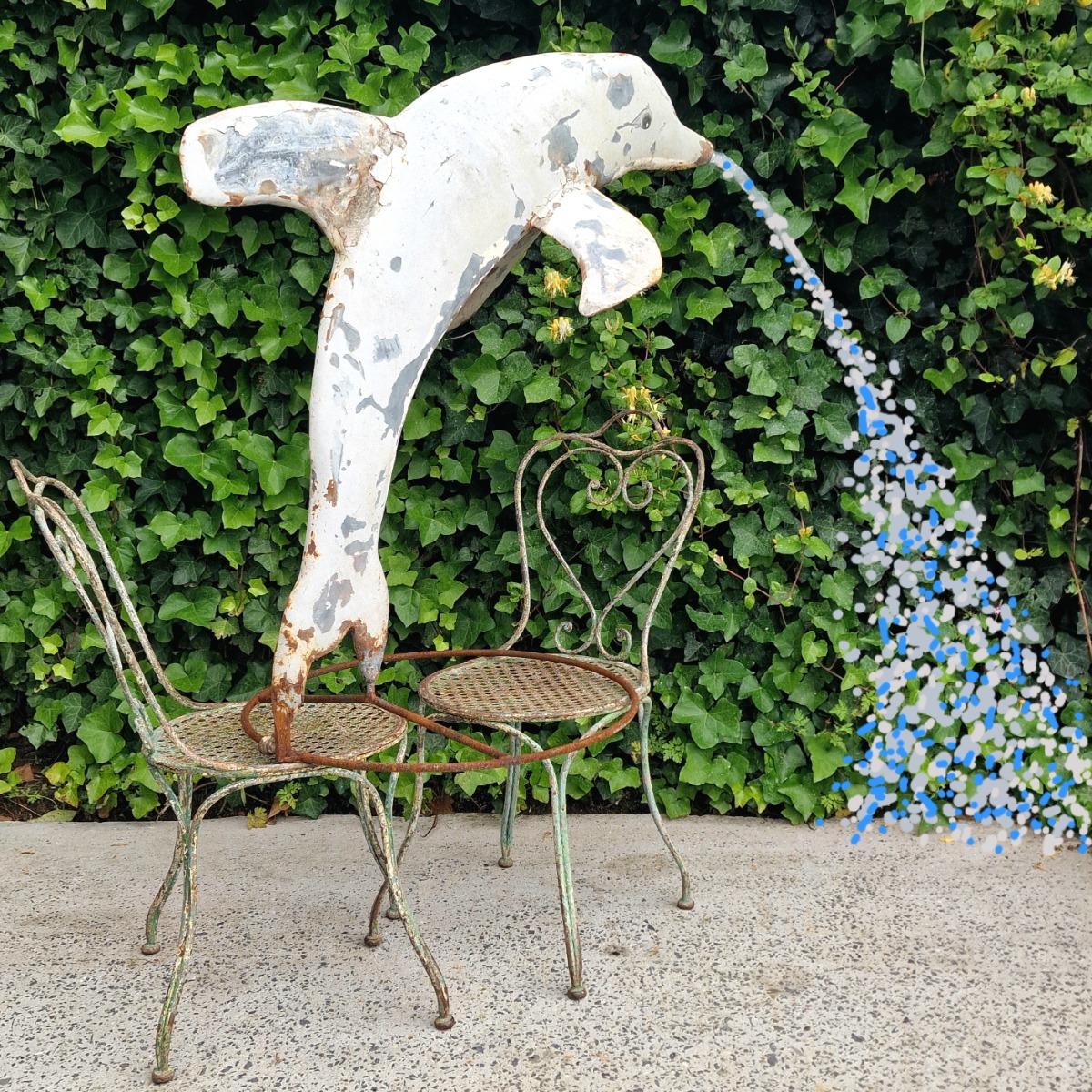 Metal dolphin fountain