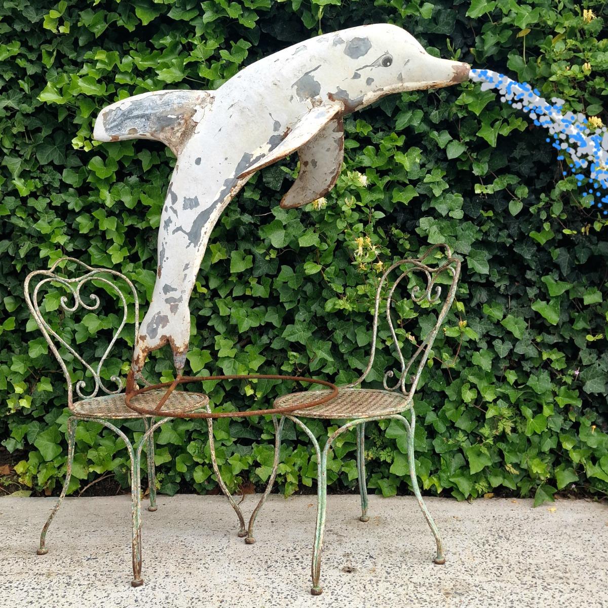 Metal dolphin fountain