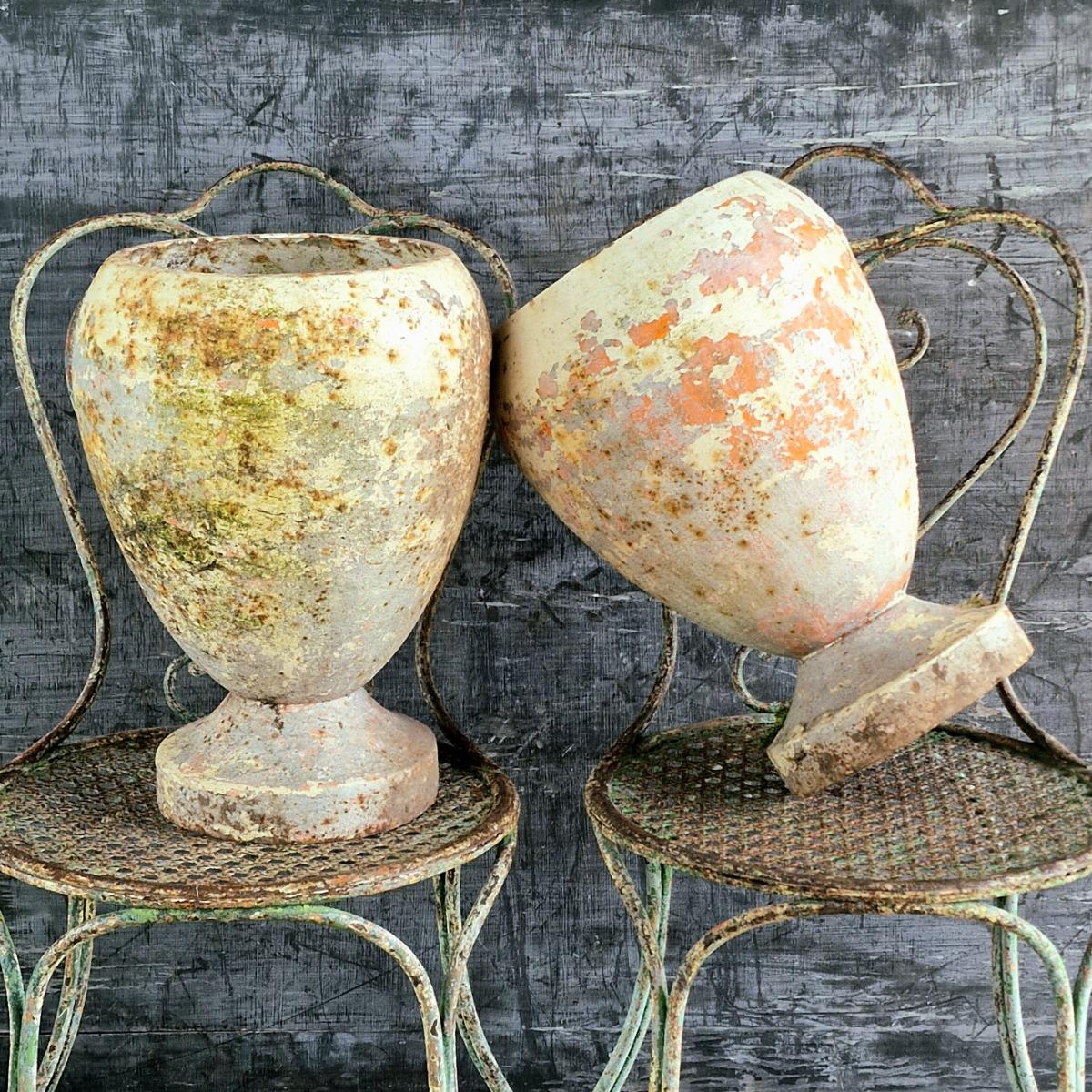 Pair of cast iron urns