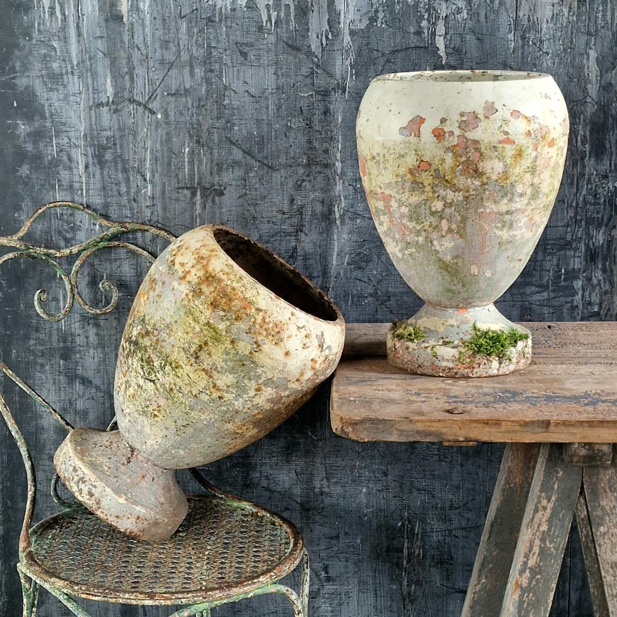 Pair of cast iron urns