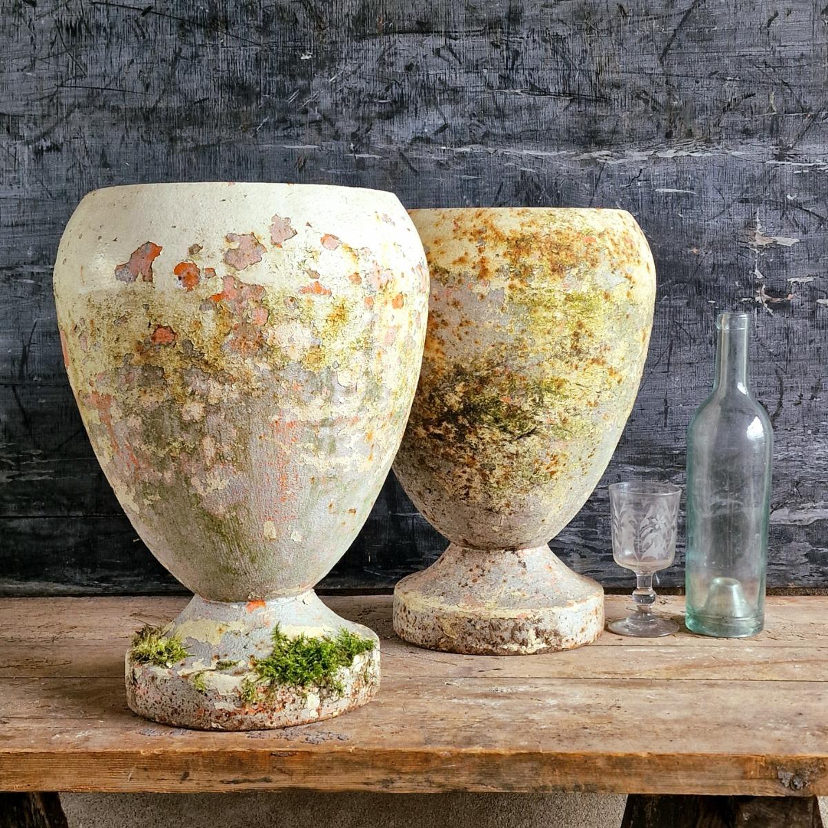 Pair of cast iron urns