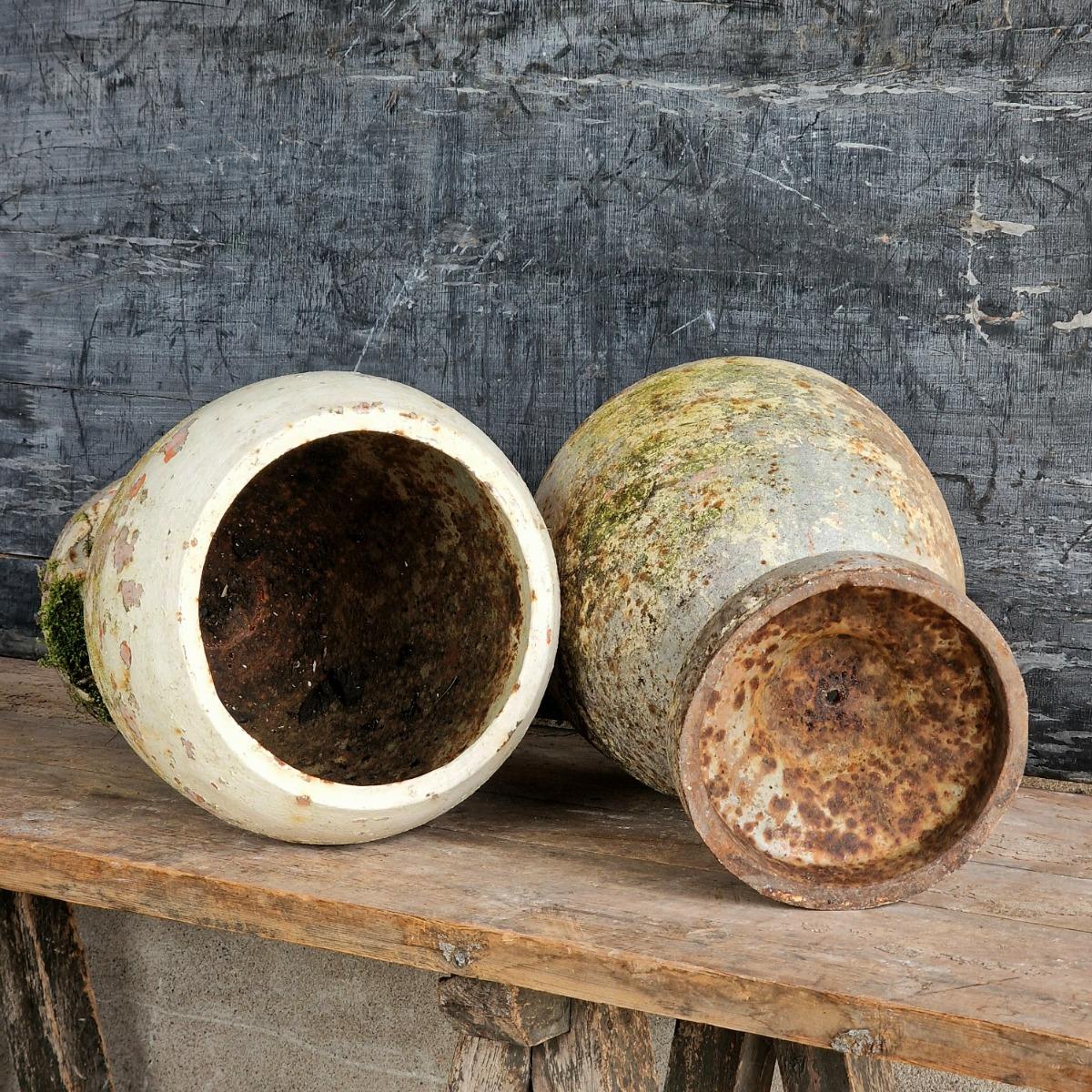 Pair of cast iron urns