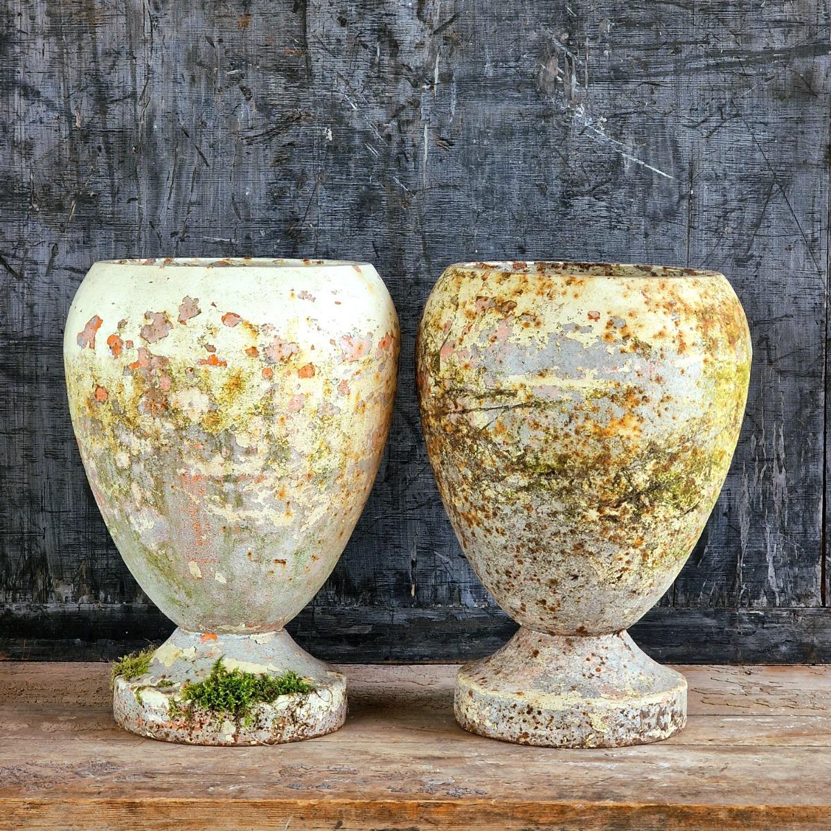 Pair of cast iron urns