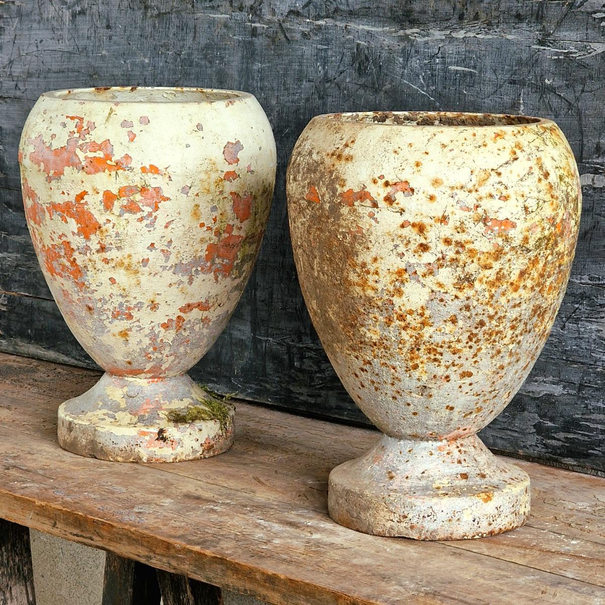 Pair of cast iron urns