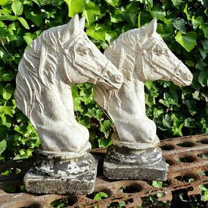Pair of cast stone horse heads