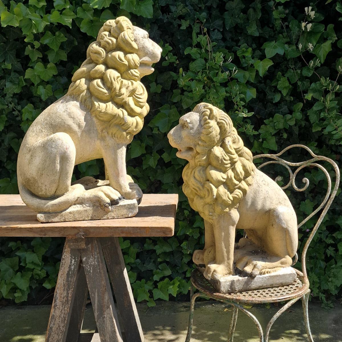 Pair of cast stone lions