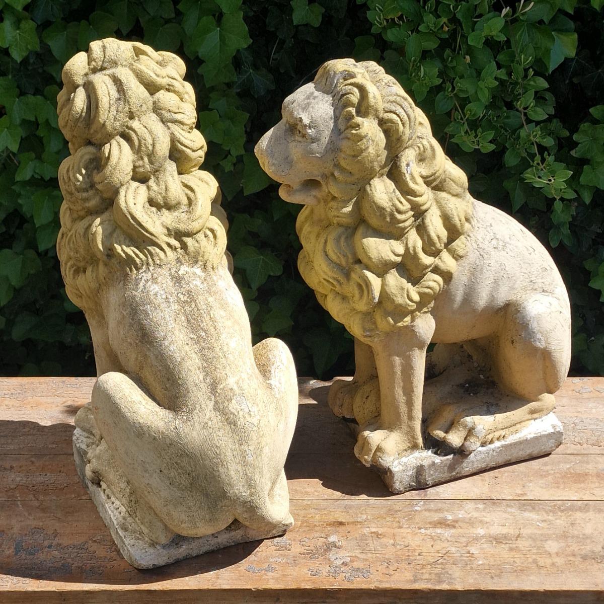 Pair of cast stone lions