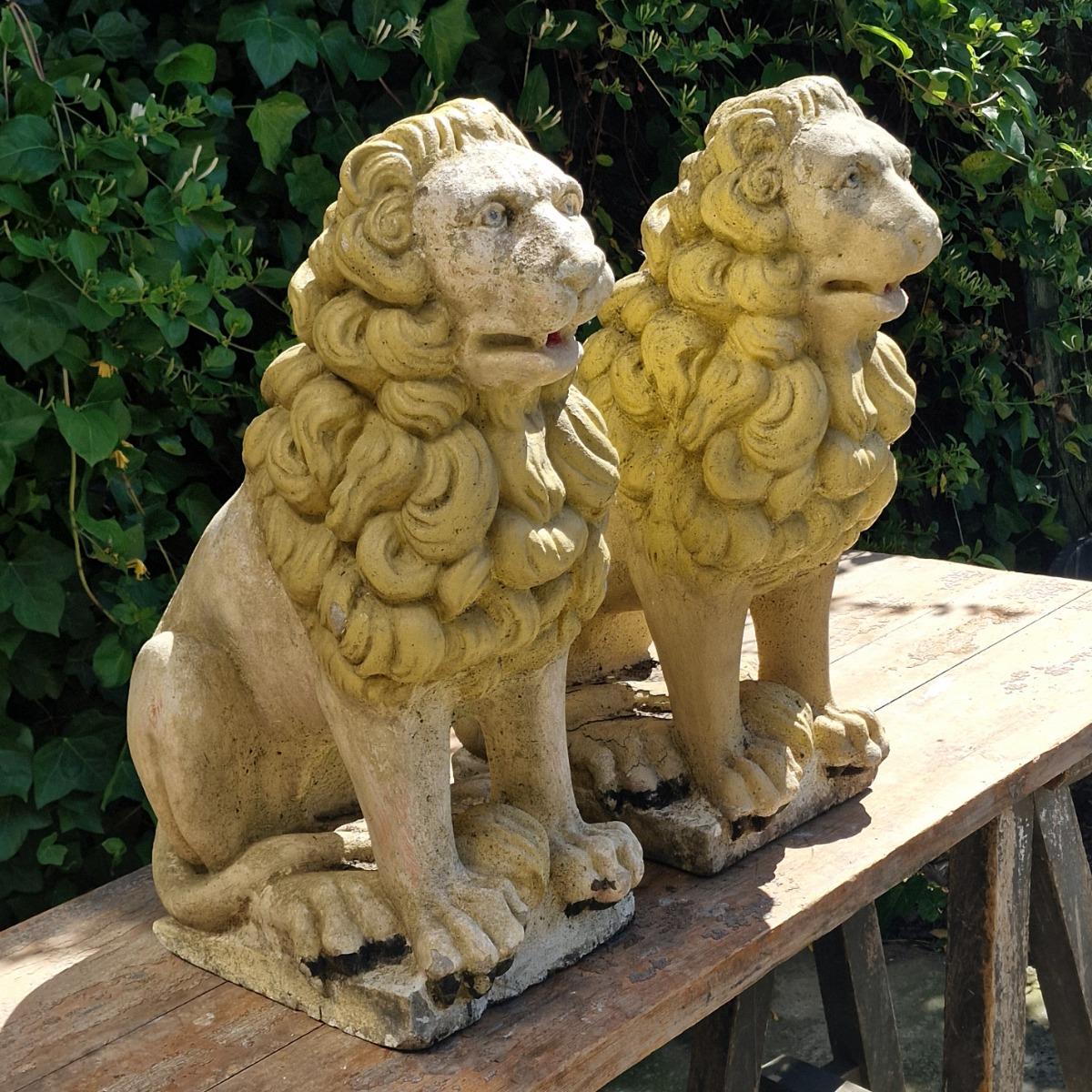 Pair of cast stone lions