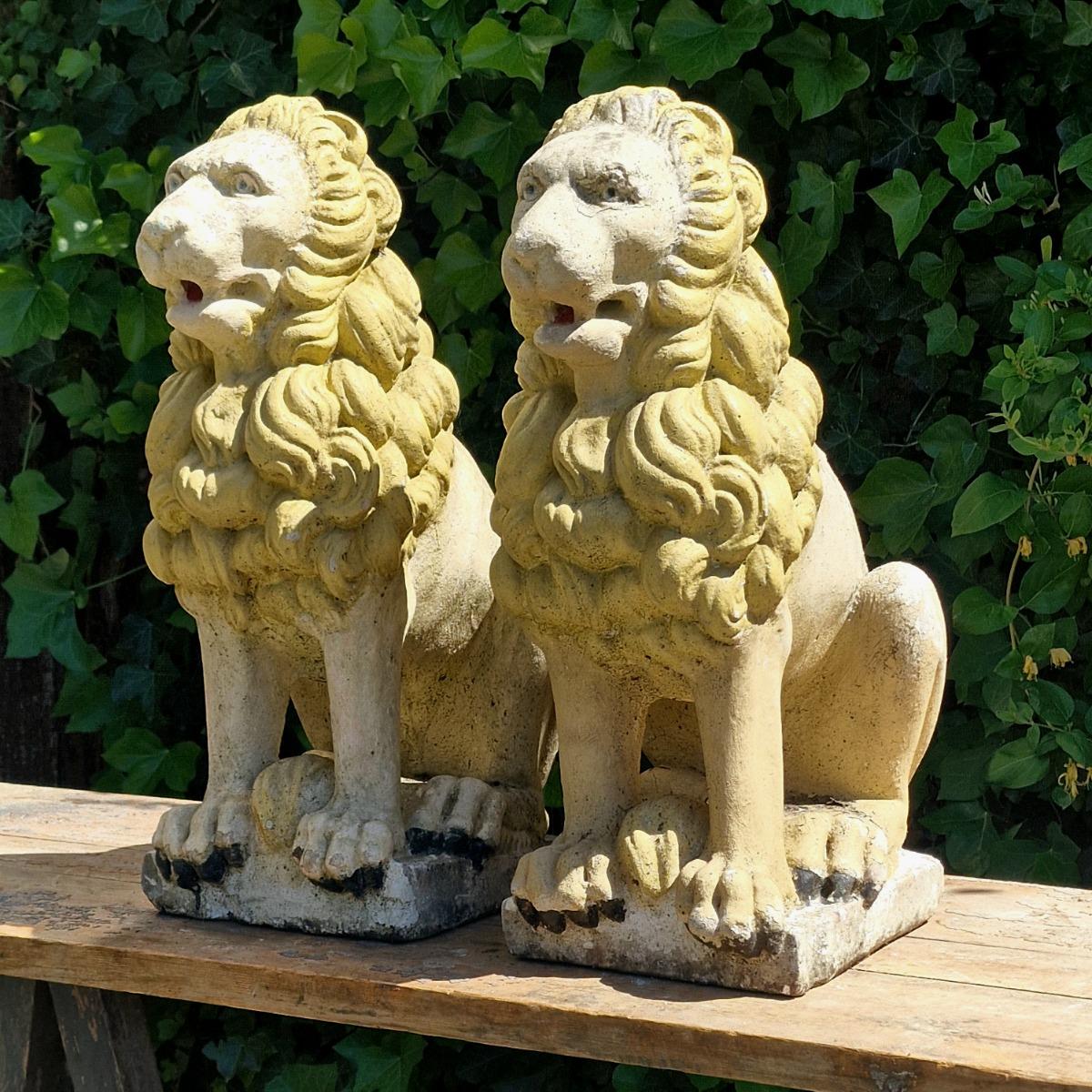 Pair of cast stone lions
