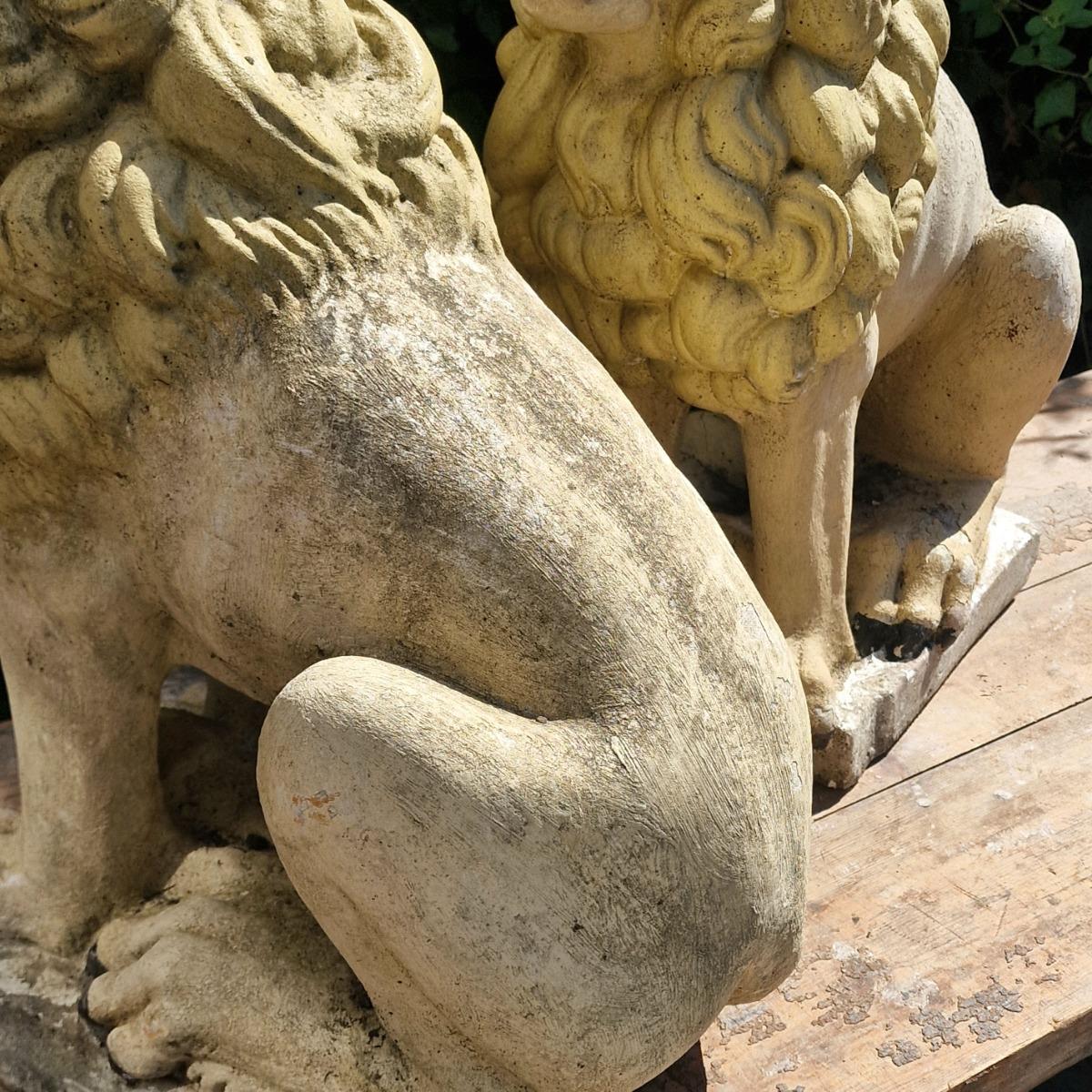 Pair of cast stone lions