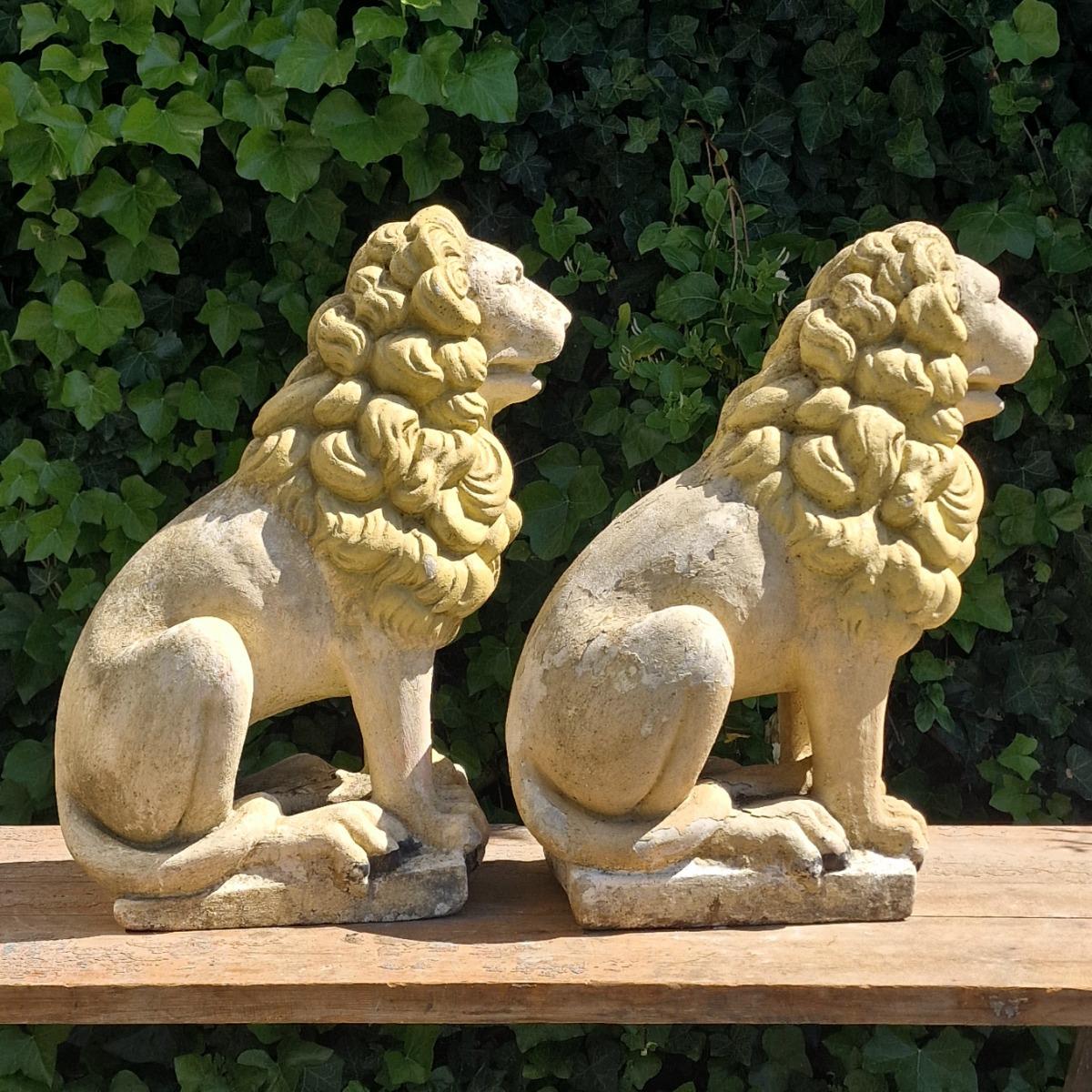 Pair of cast stone lions
