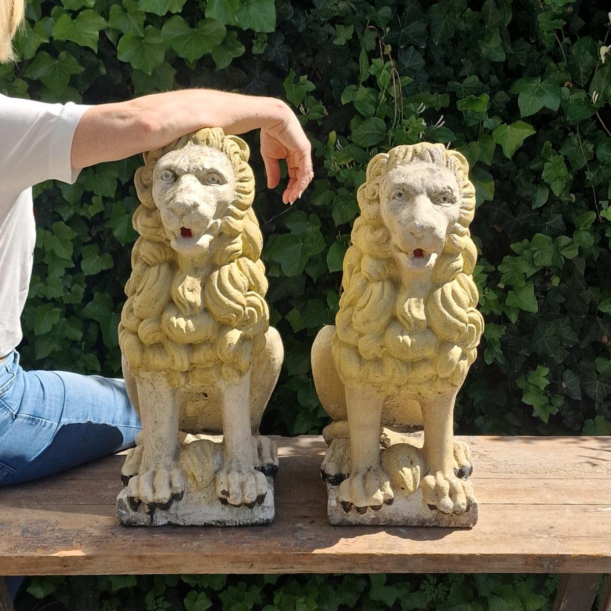 Pair of cast stone lions
