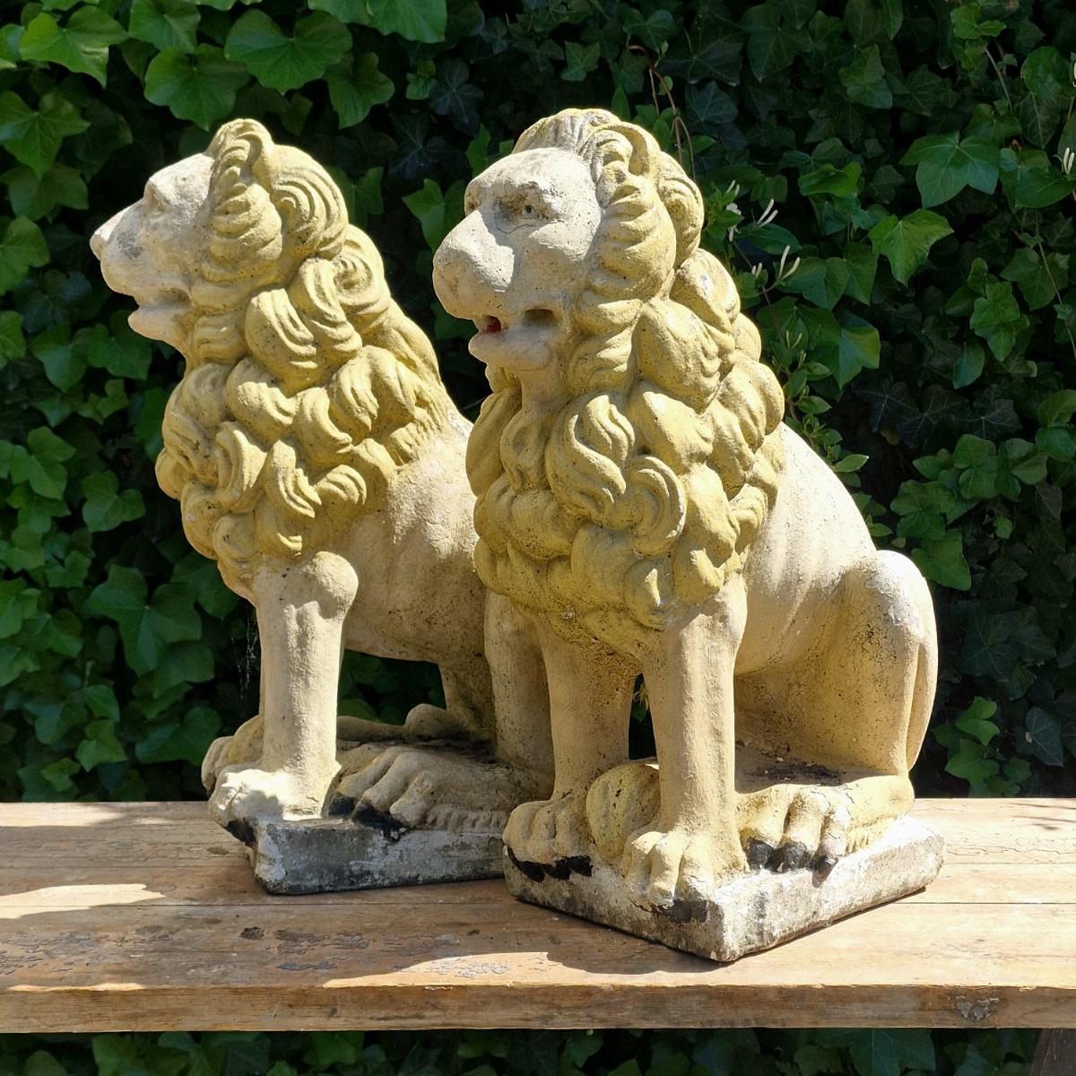 Pair of cast stone lions