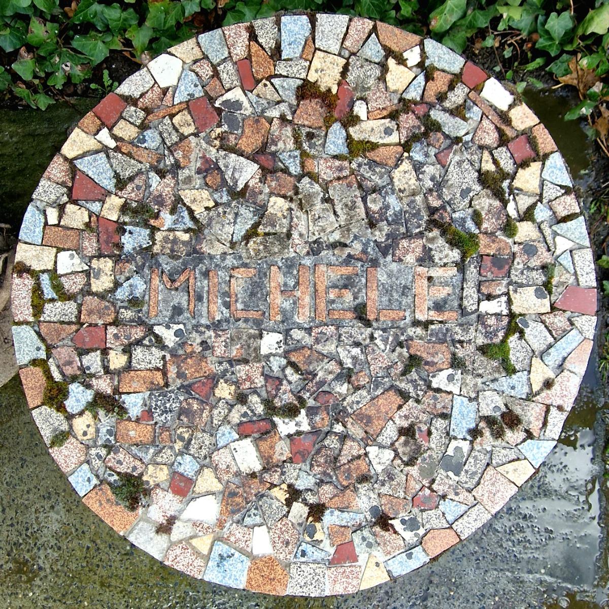 Pair of cast stone mosaic tables