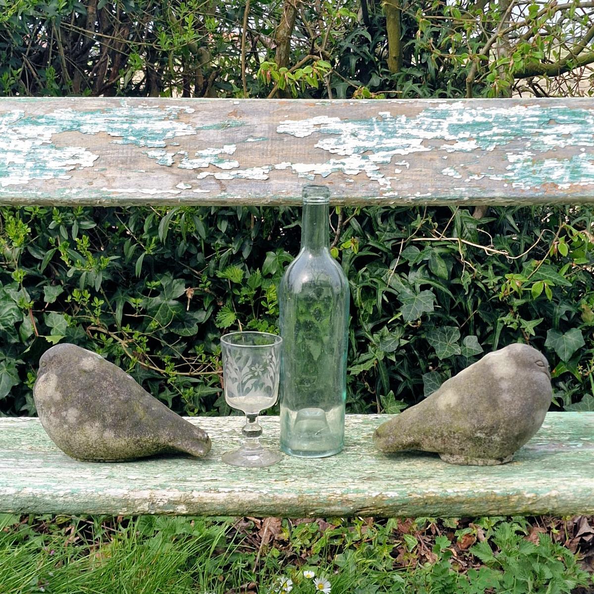 Pair of cast stone pigeons