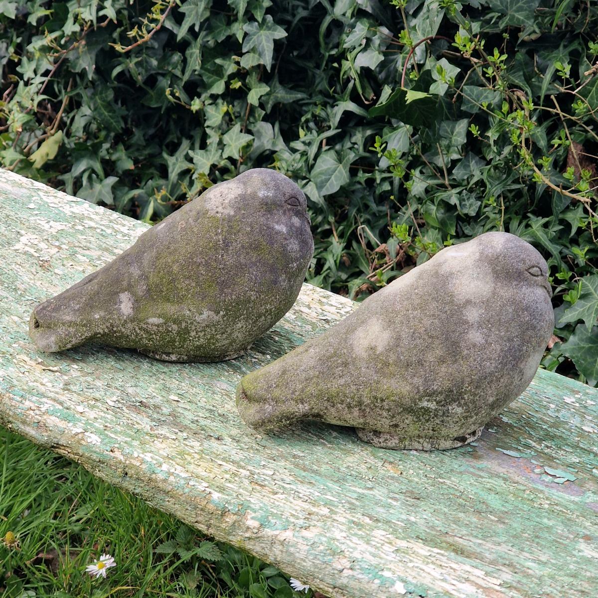 Pair of cast stone pigeons