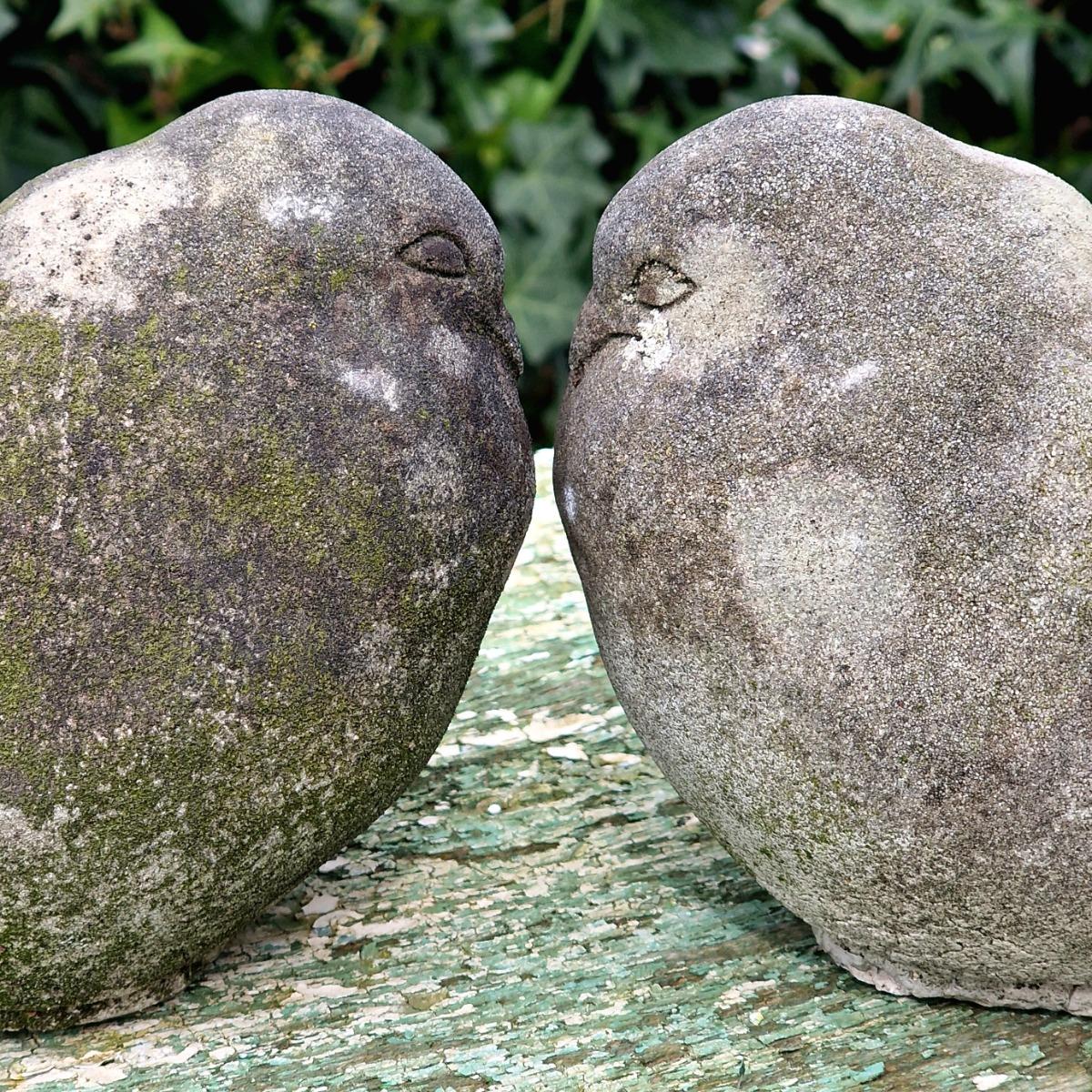 Pair of cast stone pigeons