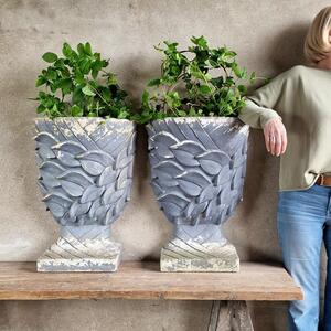 Pair of enigmatic wall planters