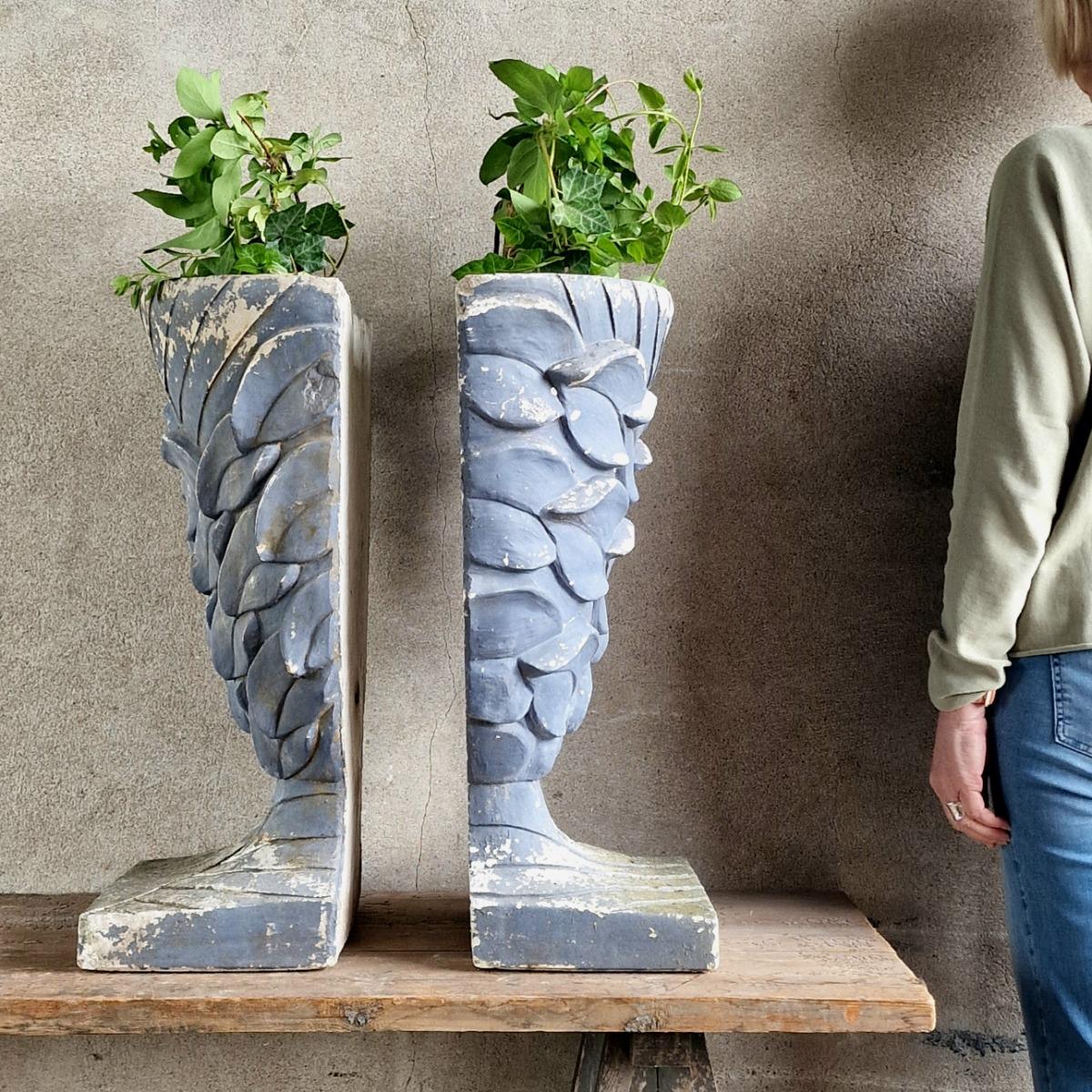 Pair of enigmatic wall planters