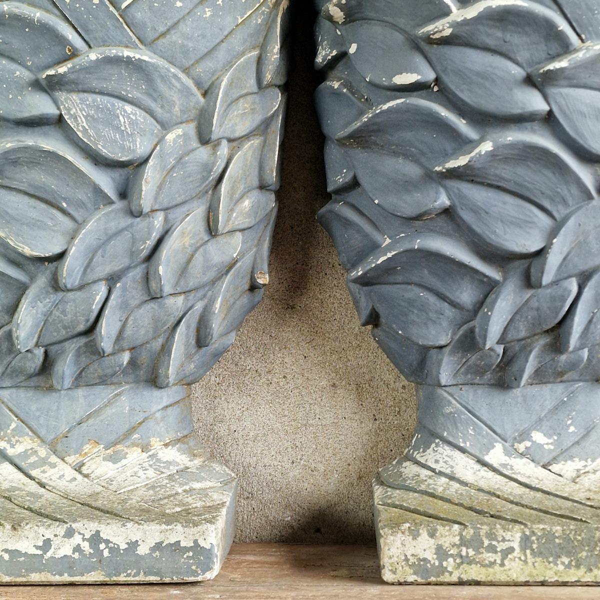 Pair of enigmatic wall planters