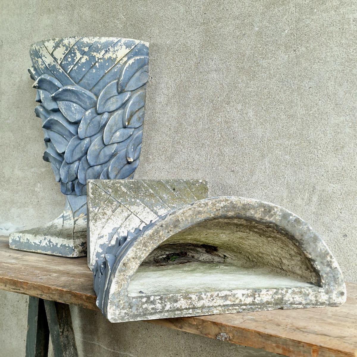 Pair of enigmatic wall planters