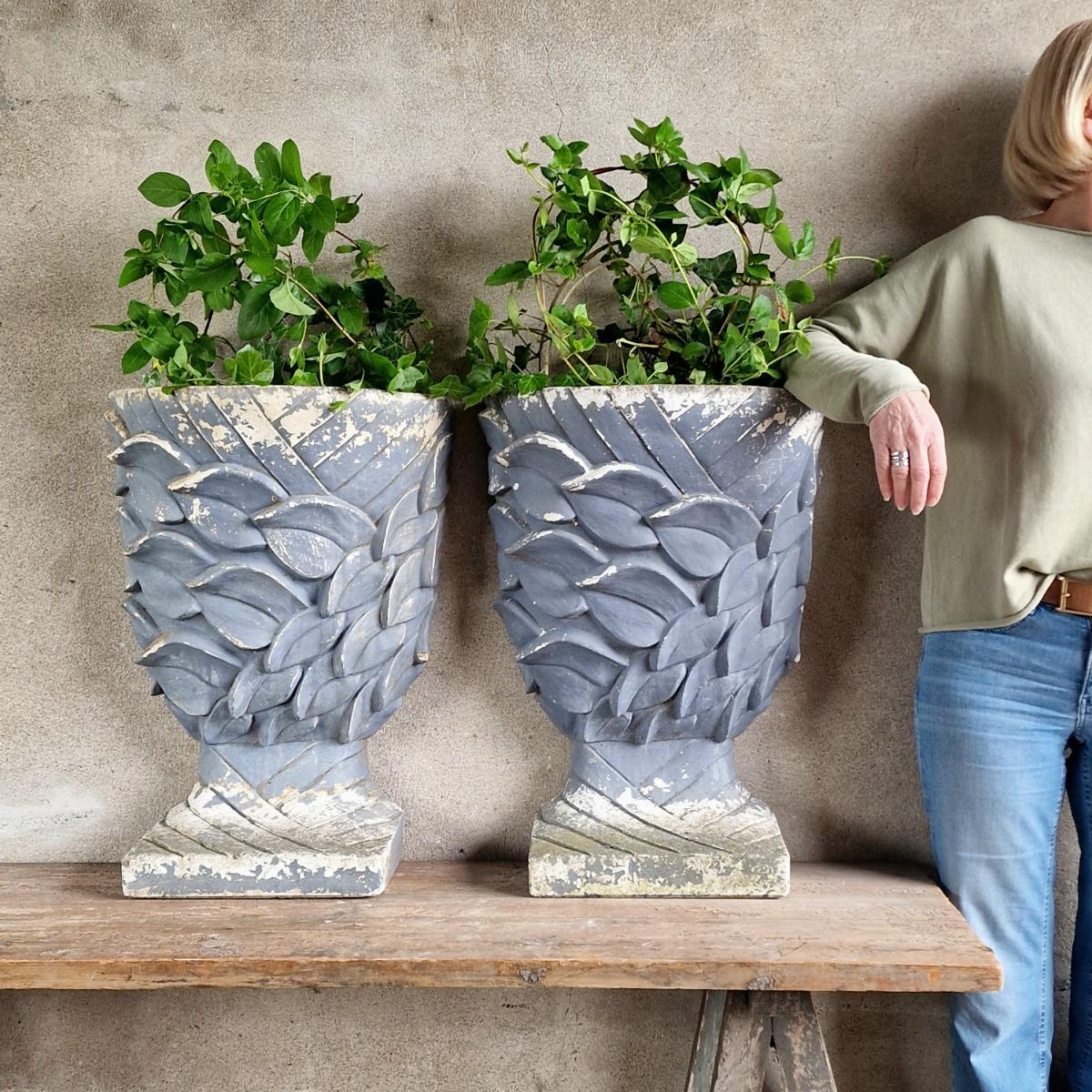 Pair of enigmatic wall planters