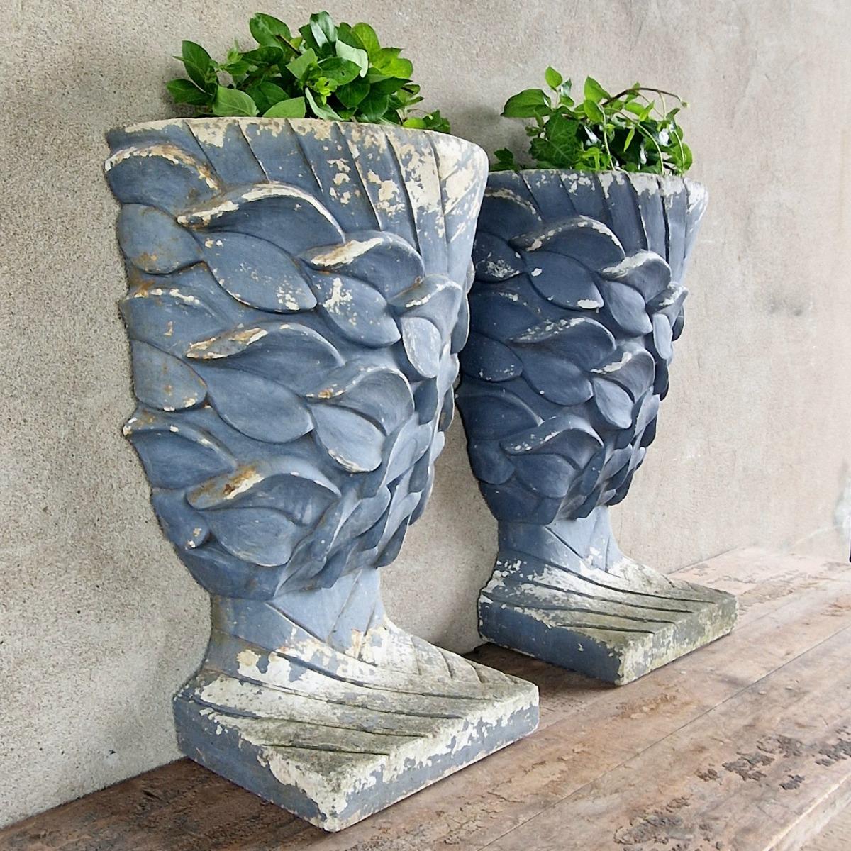 Pair of enigmatic wall planters