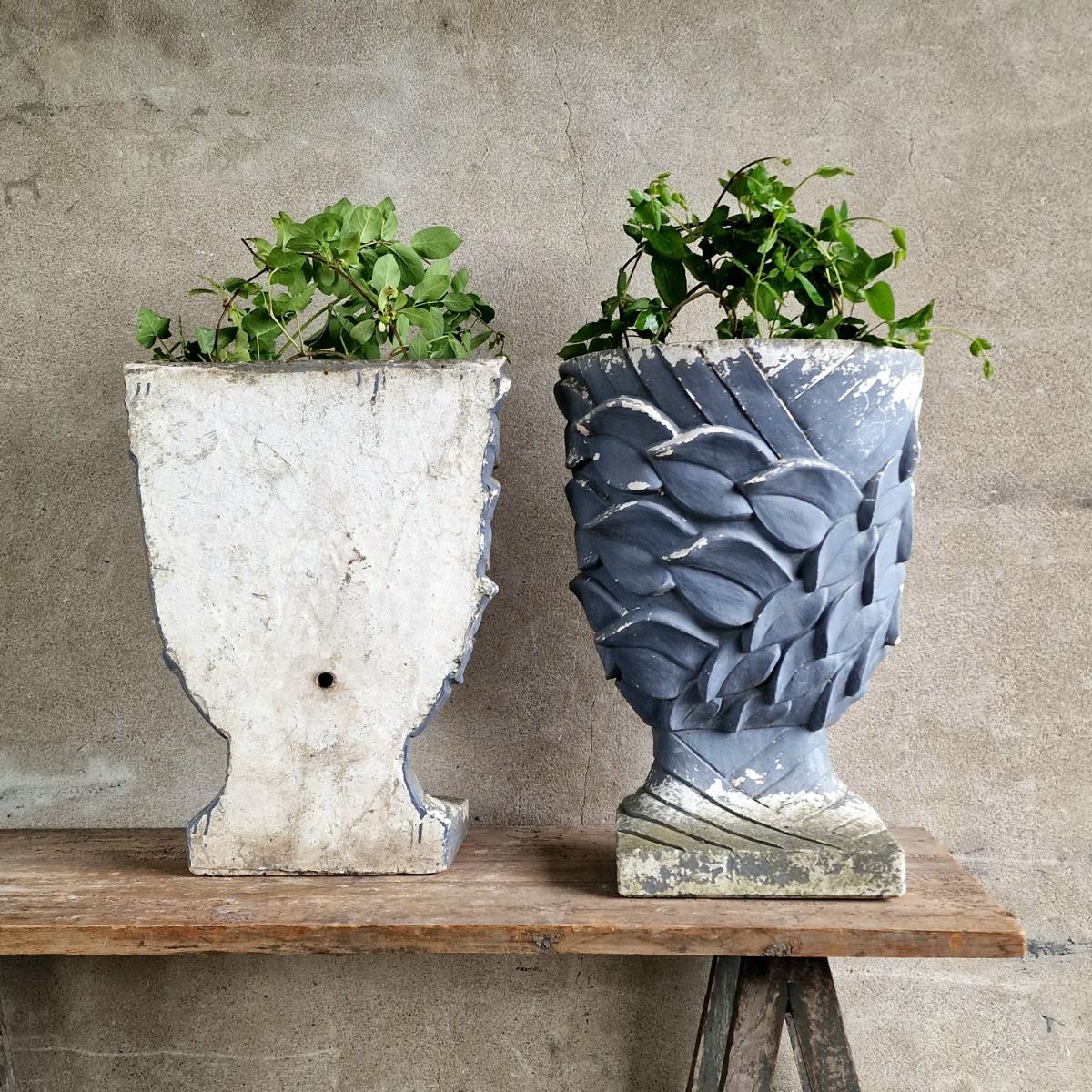 Pair of enigmatic wall planters