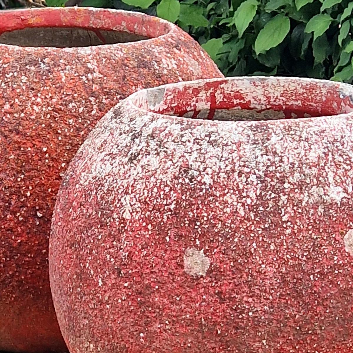 Pair of red sphere planters